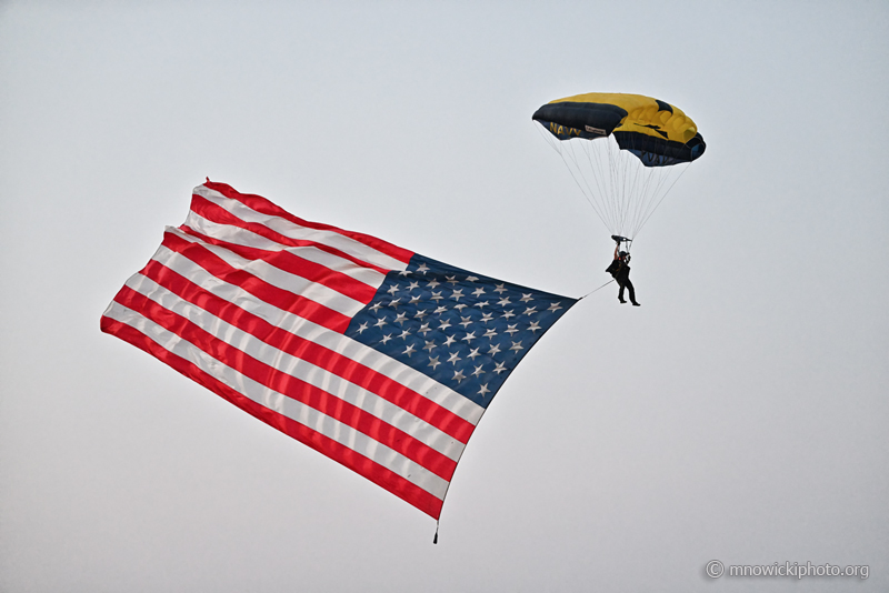 MN9_5609_01 copy.jpg - U.S. Navy Leap Frogs Parachute Team flag jump over the beach.