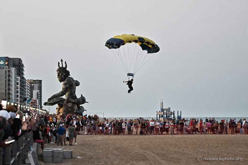 MN9_5617 copy.jpg - U.S. Navy Leap Frogs Parachute Team skydiver is landing on the beach.