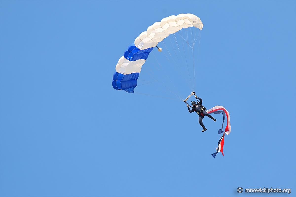 MN6_4630 copy.jpg - Flag jump. Skydiver from Wings of Blue Parachute Team.