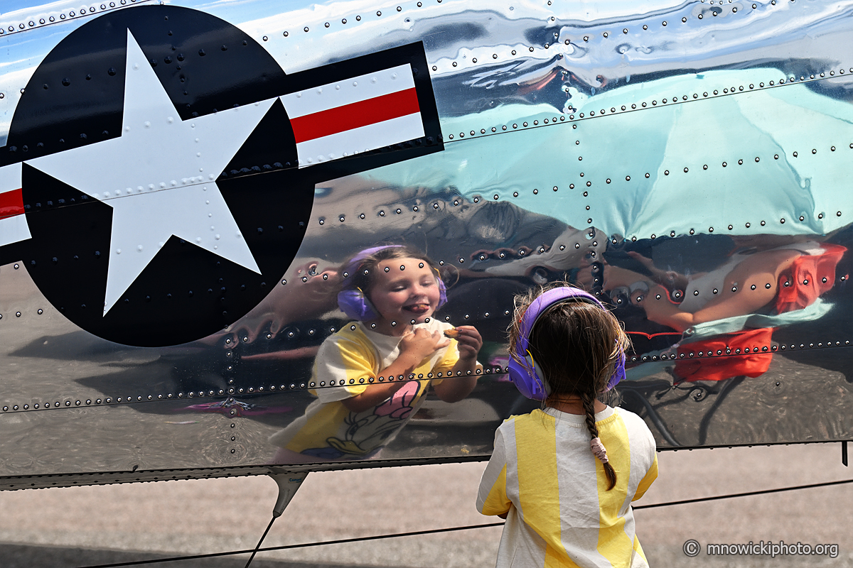 DSC_8851 copy.jpg - Little girl is plays with her reflection.